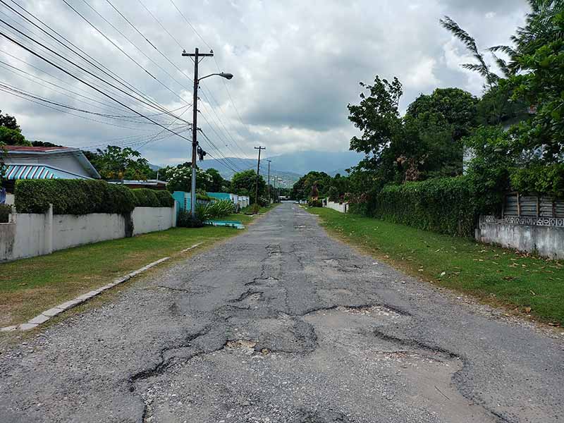 Jamaican road with pot holes