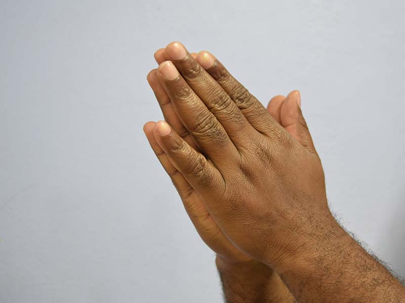 African black hands praying