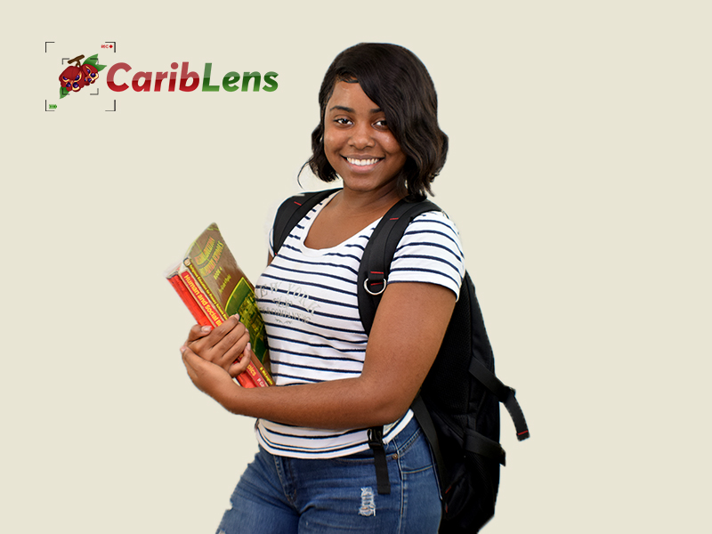 Black African School Girl University Student smiling with books in hand