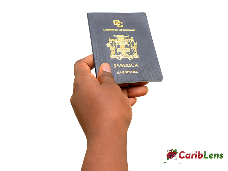 Jamaican Passport in African black hands – free photo