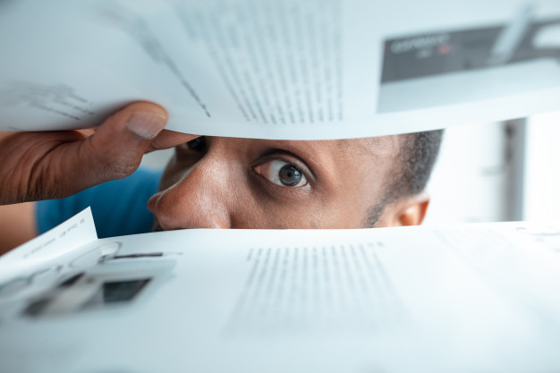 African-American black man looking for something in unusual places – Free Photo