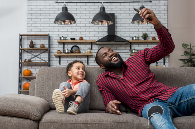 Black happy father and son taking selfie Free Photo