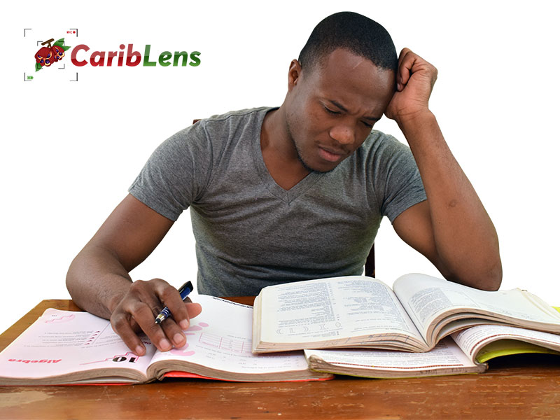 African American black man or boy – student studying for exam