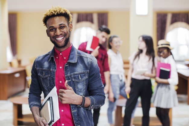 African American black student standing with notepad