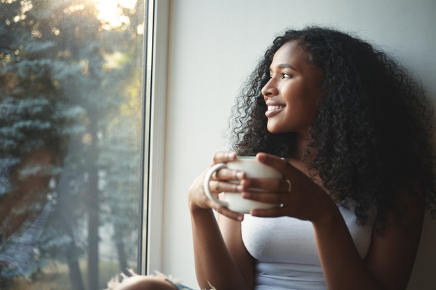 African American black woman drinking morning coffee