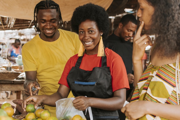 African black woman selling produce in the market