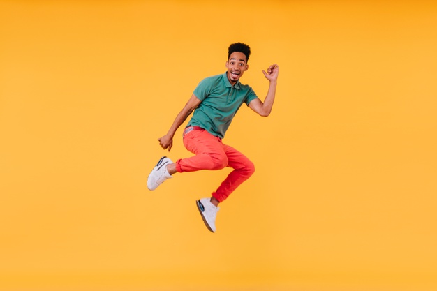 Joyful African black man jumping jumping for joy – Happy