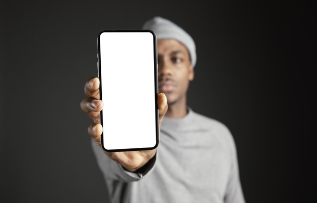 African black man holding up phone in front face