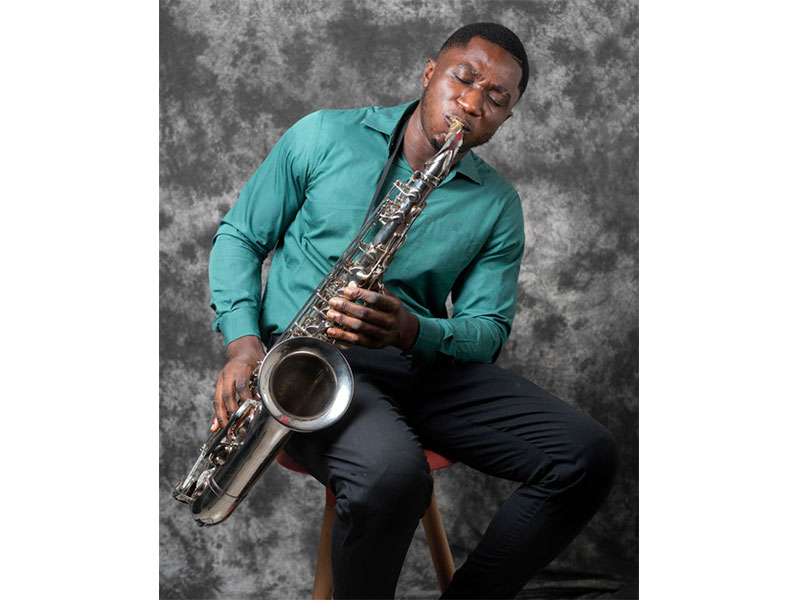 African American black man playing Jazz on saxophone