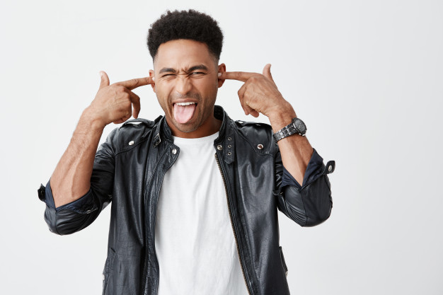 I Listen You Close Up Funny Young Beautiful Dark Skinned Man With Afro Hairstyle Fashionable Casual Outfit Plugging Ears With Fingers Showing Tongue Making Silly Face When Mother Ta 176420 12953