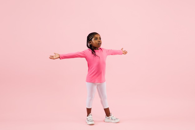 African black child hands stretched out standing tall free photo