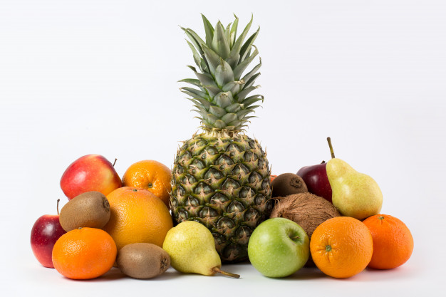 Colorful fruits tasty fresh ripe juicy on a white desk Free Photo