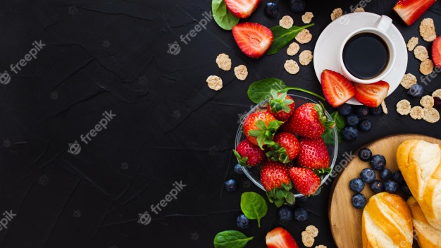 Healthy breakfast on a black wooden background. top view. free space for your text Free Photo