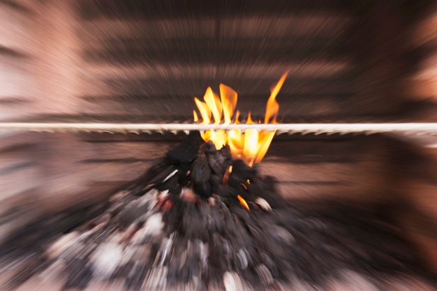 Blurry image of coal burning in barbecue Free Photo