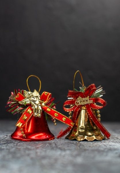 Front view holiday bells on light-grey table Free Photo