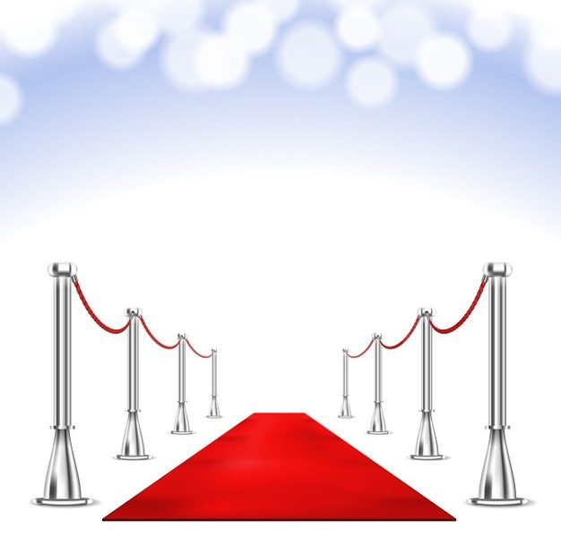 Red carpet and bokeh lights Free Vector