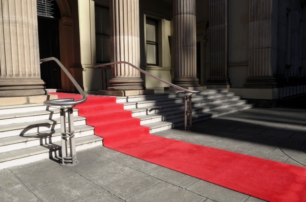 Red carpet in front of a luxury hotel Free Photo