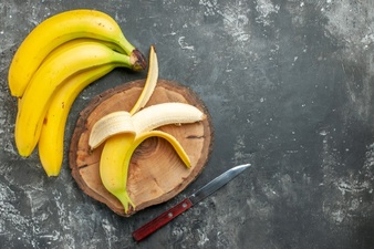 View Nutrition Source Fresh Bananas Bundle Peeled Wooden Cutting Board Knife Gray Background 140725 138479