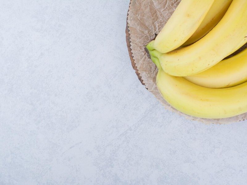 Bunch of ripe fruit bananas on wooden plate. high quality photo Free Photo