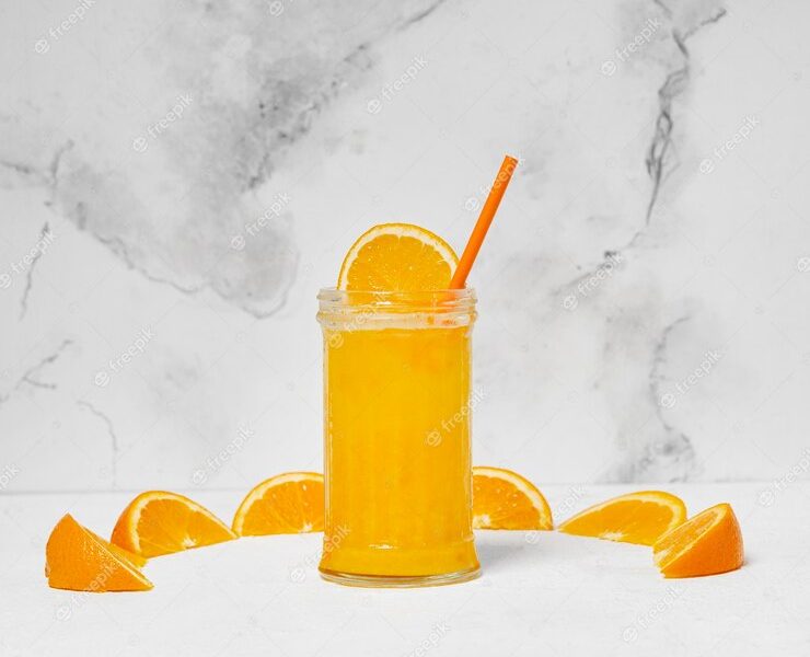 Delicious orange juice glass Free Photo