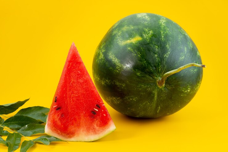 A front view fresh watermelon sweet and sliced on yellow, fruit summer color Free Photo