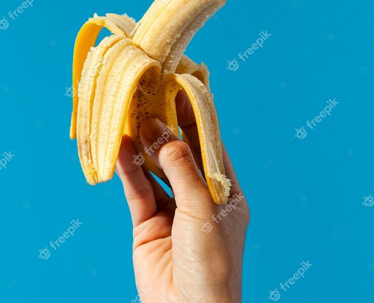 Person holding a banana Free Photo Person holding a banana Free Photo