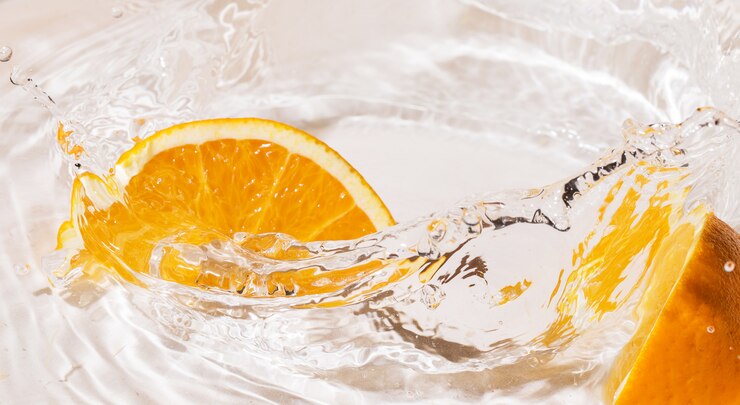 Slices of an orange in water Free Photo