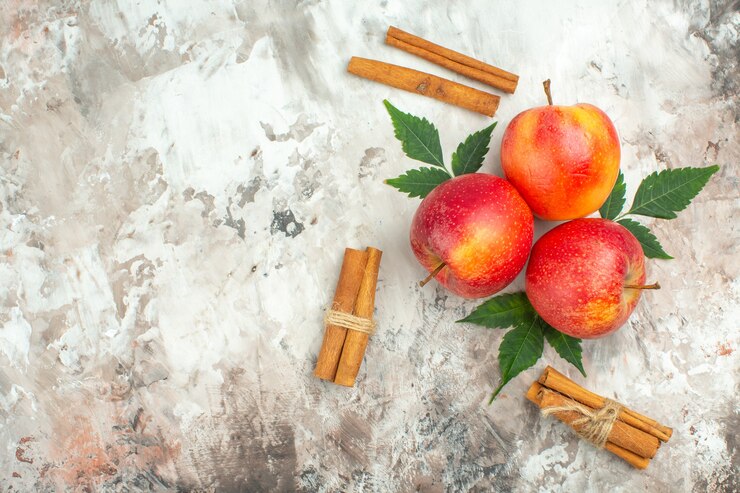 Top View Fresh Natural Red Apples Cinnamon Limes Left Side Mixed Color Background 140725 141649