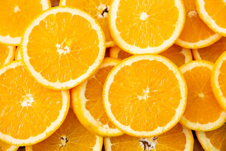 Top view of many round orange slices Free Photo