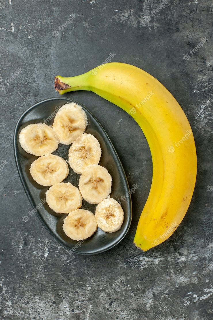 Vertical View Organic Nutrition Source Fresh Banana Chopped Whole Dark Background 140725 141377