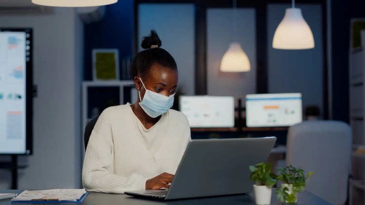 African Woman With Face Mask Reading Emails Late Night Respect Deadline Project Working New Normal Business Office Analysing Documents Making Strategy Overtime During Global Pandemic 482257 2422