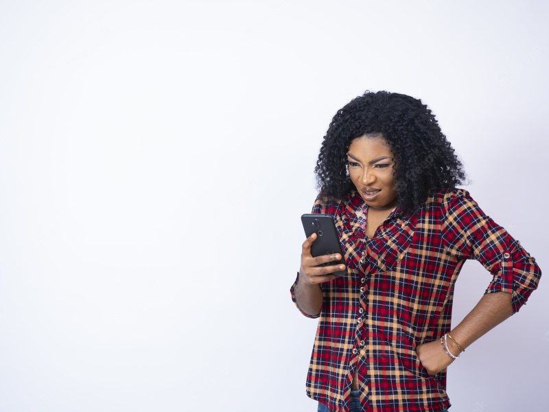 African American black woman looking at her phone disappointed Free Photo African American black woman looking at her phone disappointed Free Photo
