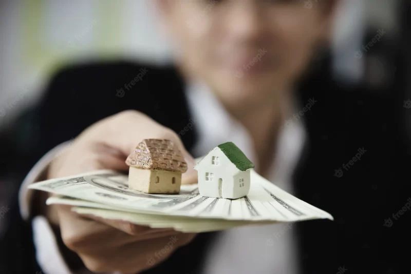 Business man show money bank note make financial plan invite people to sell or buy house and c Business man show money bank note make financial plan invite people to sell or buy house and c