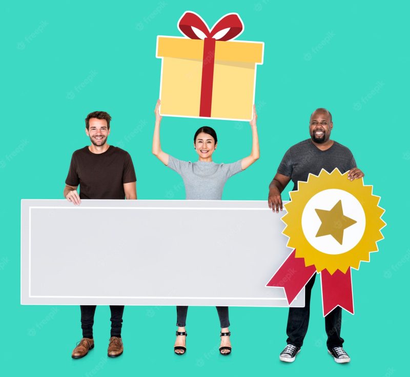 Cheerful team holding a competition award in blank banner Free Photo