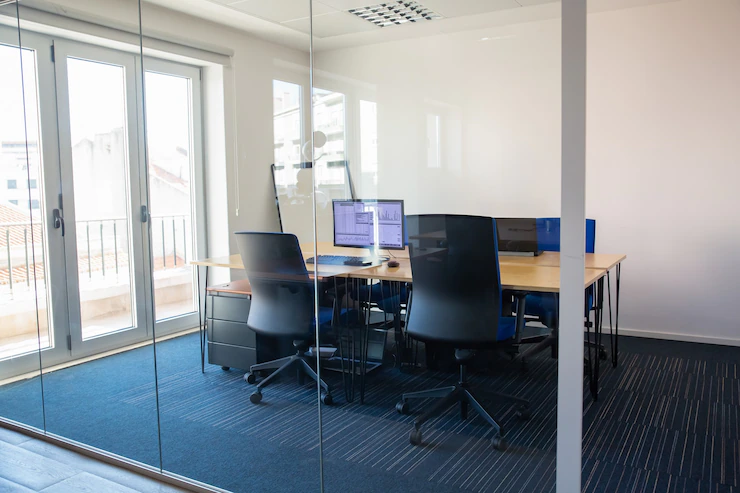 Empty Boardroom Glass Wall Meeting Room With Conference Table Shared Desk Team Workplaces Trading Graphs Monitor Office Interior Commercial Real Estate Concept 74855 14233
