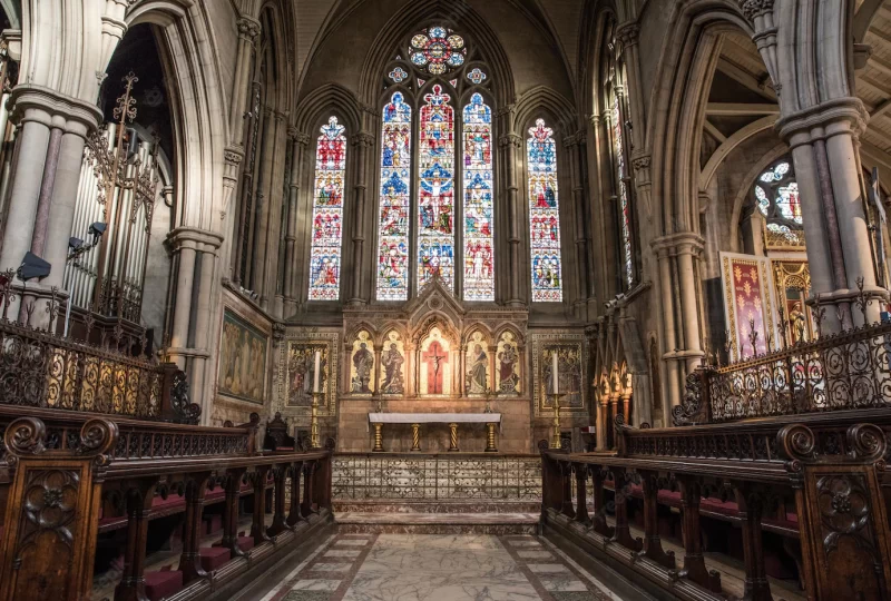 Inside view of a church with religious icons on the walls and windows Free Photo