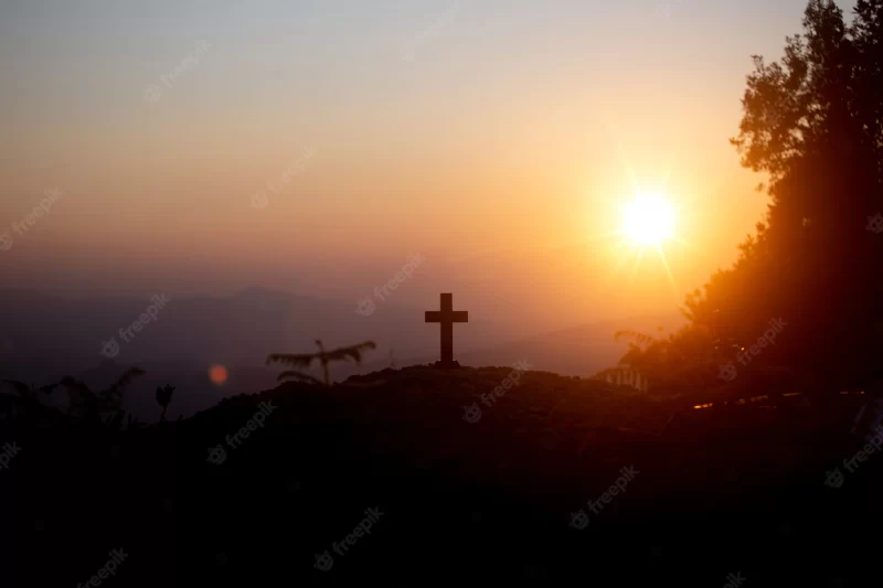 Resurrection concept: crucifixion of jesus christ cross at sunset Free Photo