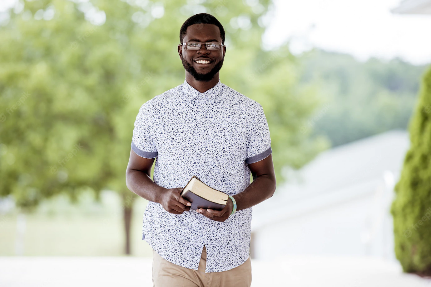 Shallow Focus Shot Male Standing While Holding Bible Looking Camera 181624 8326