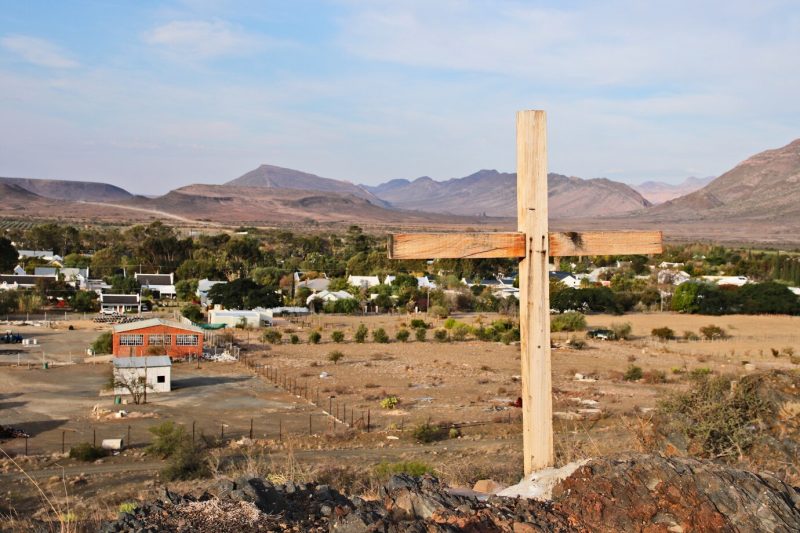 A wooden cross overlooking the town of prince albert in south africa Free Photo
