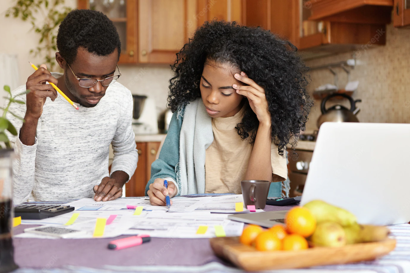 Young African Husband Wife Doing Paperwork Together Home Planning New Purchase Calculating Family Expenses Sitting Kitchen Table With Laptop Calculator Domestic Budget Finances 273609 2068