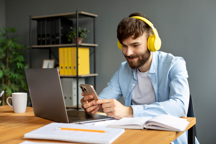 Young Man Listening Music Headphones While Working 23 2149116541