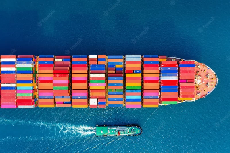 Aerial view of container cargo ship in sea. Free Photo