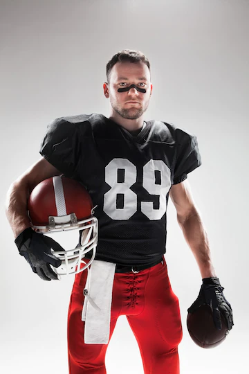 American Football Player Posing With Ball 155003 15549