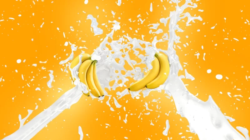 Banana milkshake splash background Free Photo