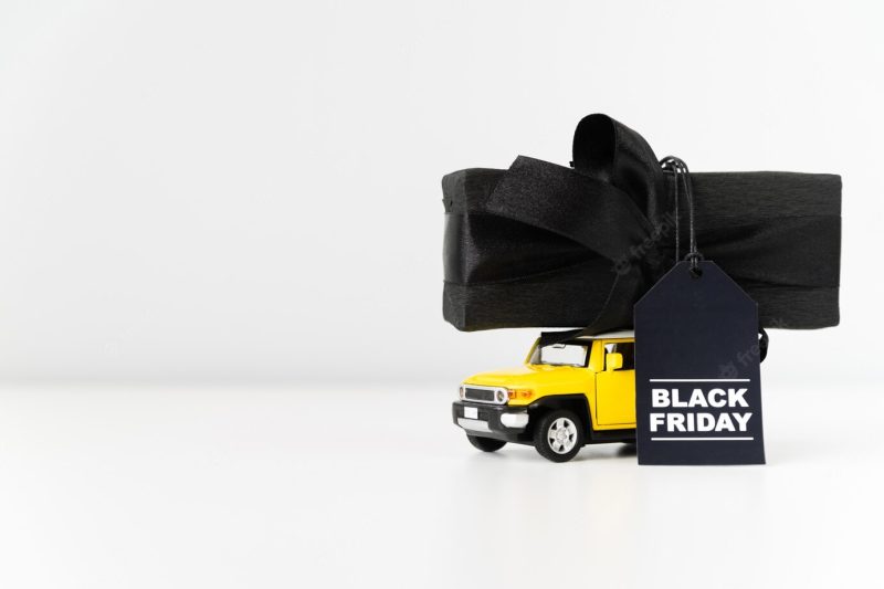 Black Friday toy car carrying gift Free Photo