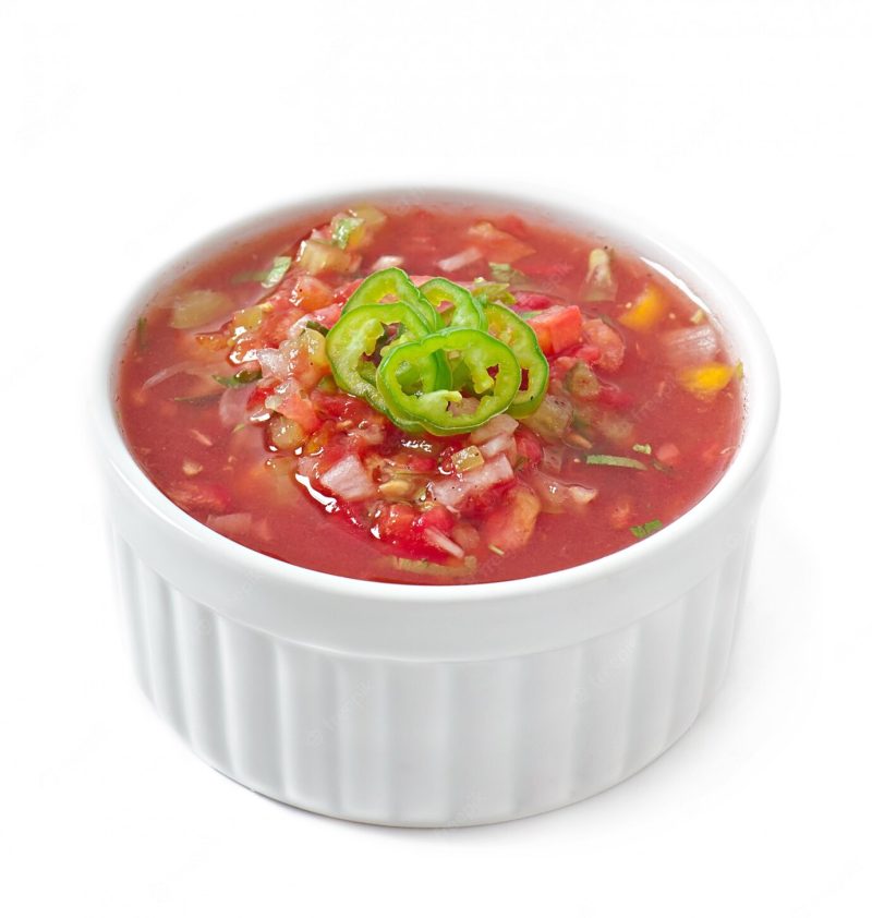 Bowl of fresh salsa dip isolated Free Photo