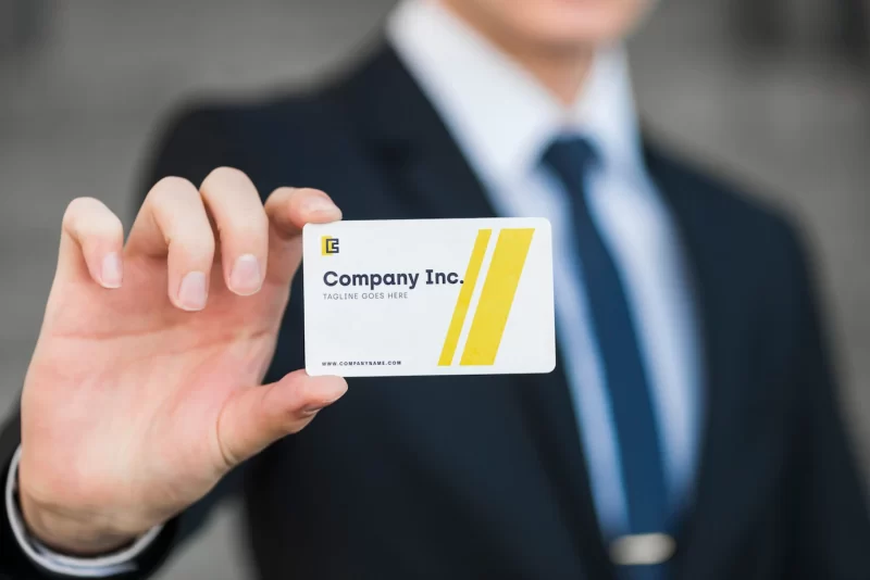 Businessman with business card mockup Free Psd