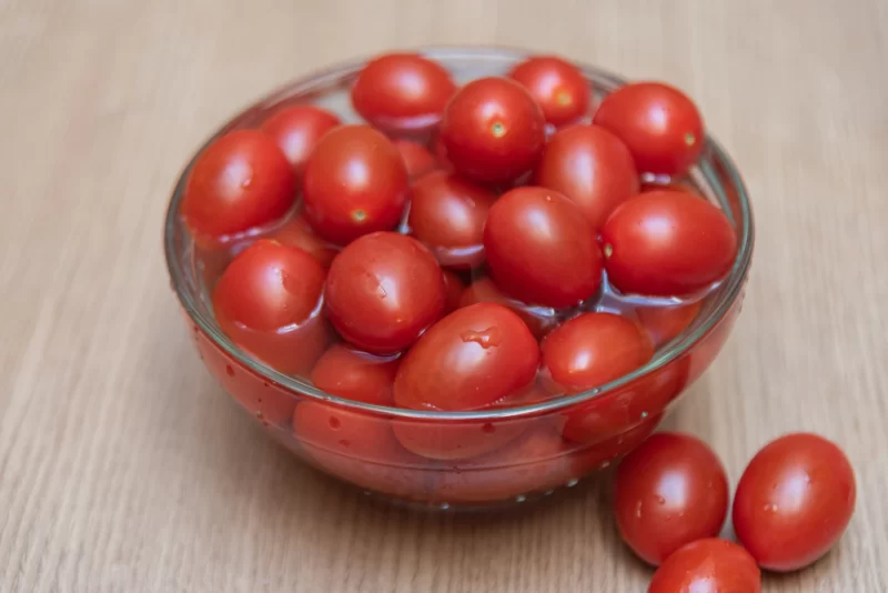 Cherry tomatoes on the table Free Photo