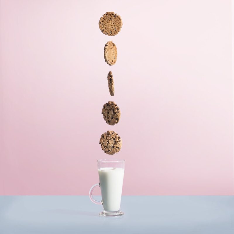 Chocolate cookies above a glass of milk Free Photo