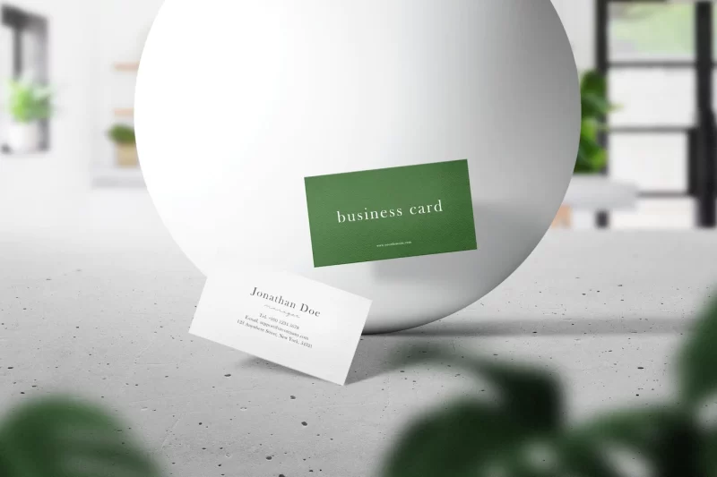 Clean minimal business card mockup floating on top cement with sphere Free Psd